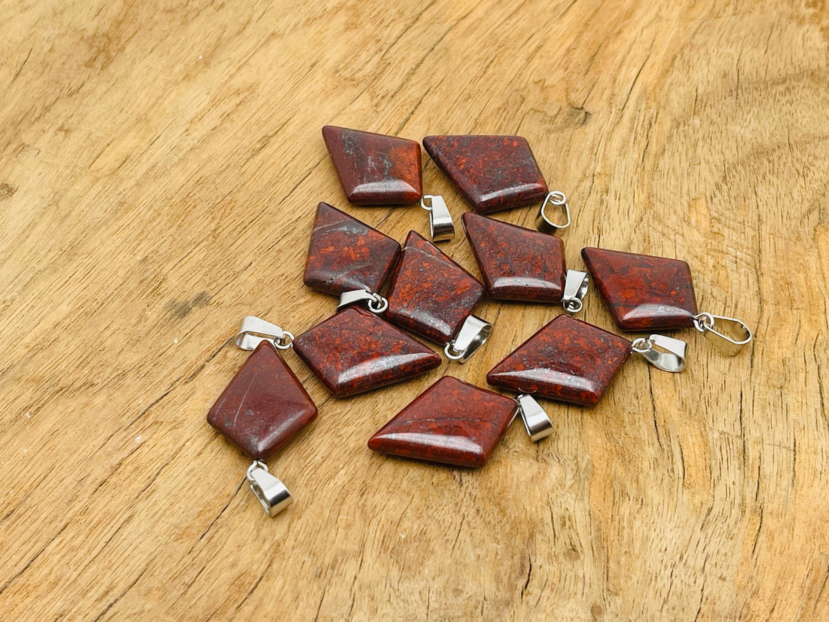Chicken Bloodstone Jasper pendant featuring a geometric triangle shape, showcasing rich red and green tones in a natural gemstone.
