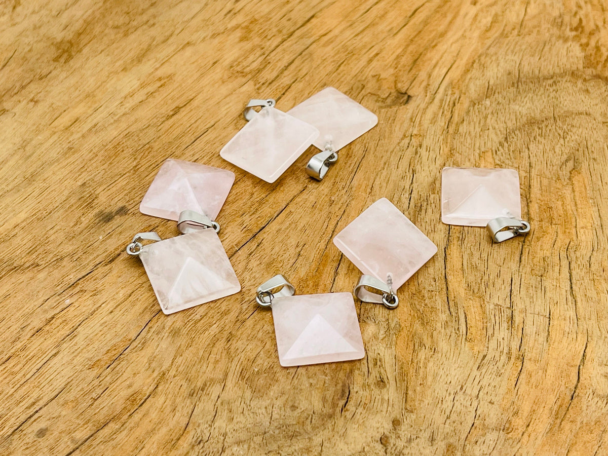 Natural rose quartz pyramid gemstone pendant from GemstoneGO, showcasing a polished pink quartz pyramid jewelry piece.