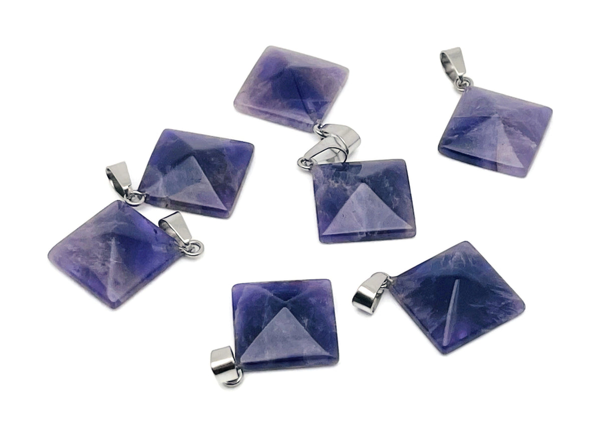 Natural amethyst pyramid gemstone pendant from GemstoneGO, showcasing a polished purple crystal pendant on a silver chain.