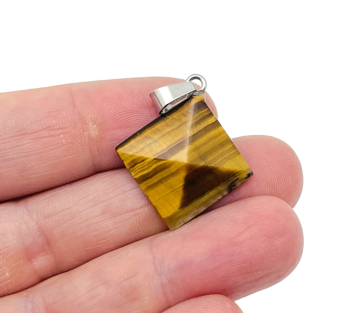 Tiger Eye pyramid gemstone pendant from GemstoneGO, showcasing a natural stone carved into a pyramid shape for jewelry or display.