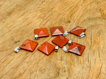Red Jasper pyramid gemstone pendant from GemstoneGO featuring a natural red jasper stone on a silver chain.