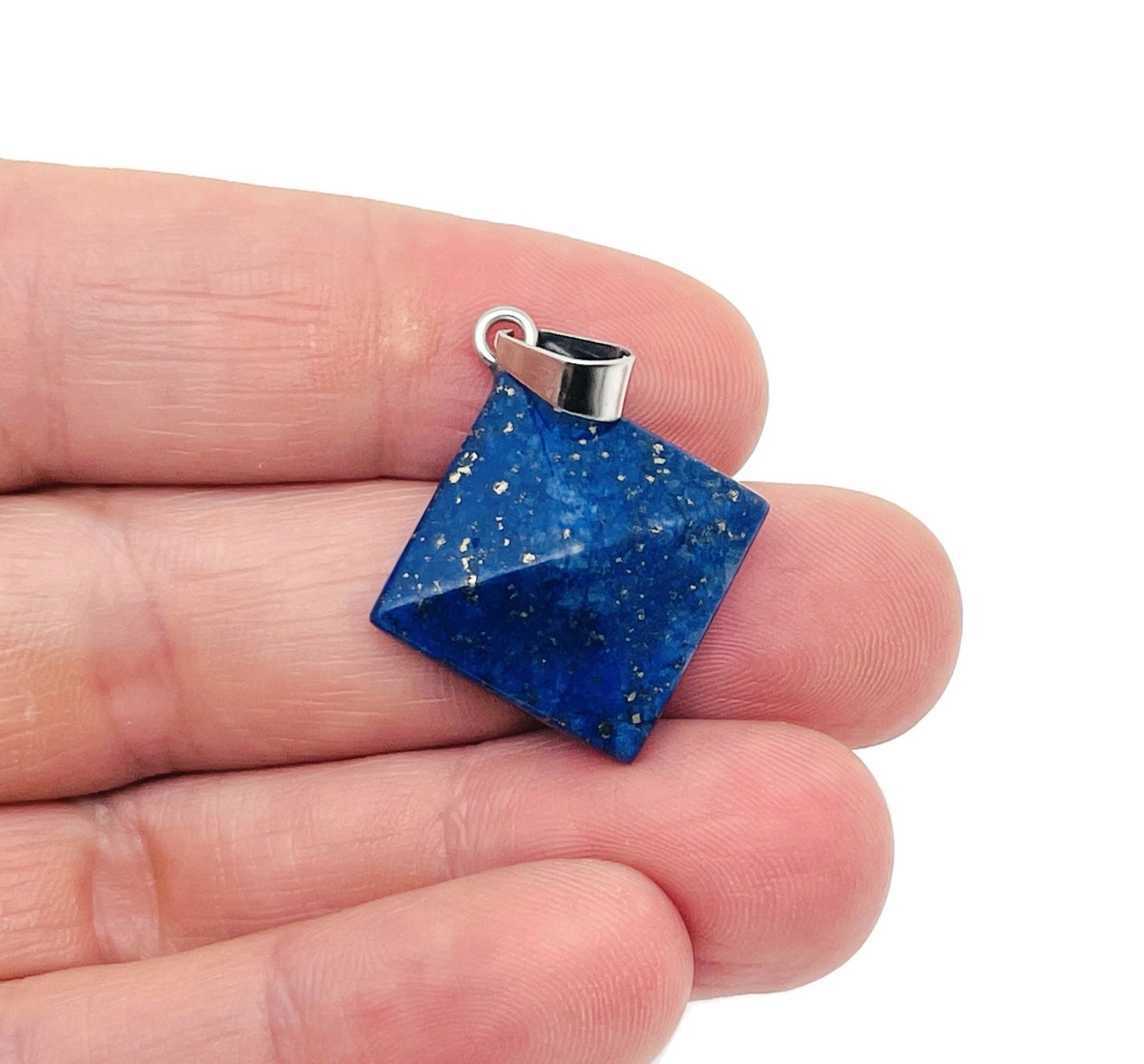 Lapis Lazuli pyramid gemstone pendant from GemstoneGO featuring a natural blue gemstone with golden pyrite inclusions.