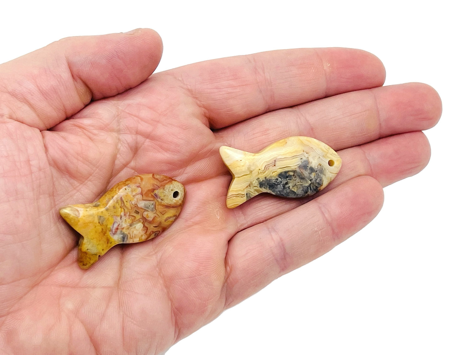 Crazy Lace Agate fish-shaped gemstone pendant with Pisces zodiac symbol and hole for necklace chain, by GemstoneGO.