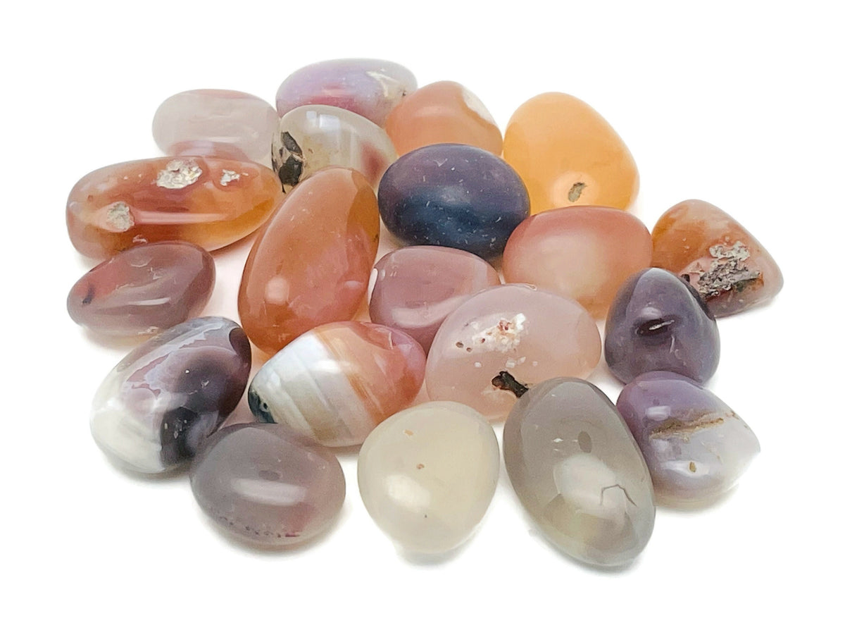 Crimson Agate tumbled stone from GemstoneGO, showing smooth, polished red and orange mineral with natural patterns and glossy finish.