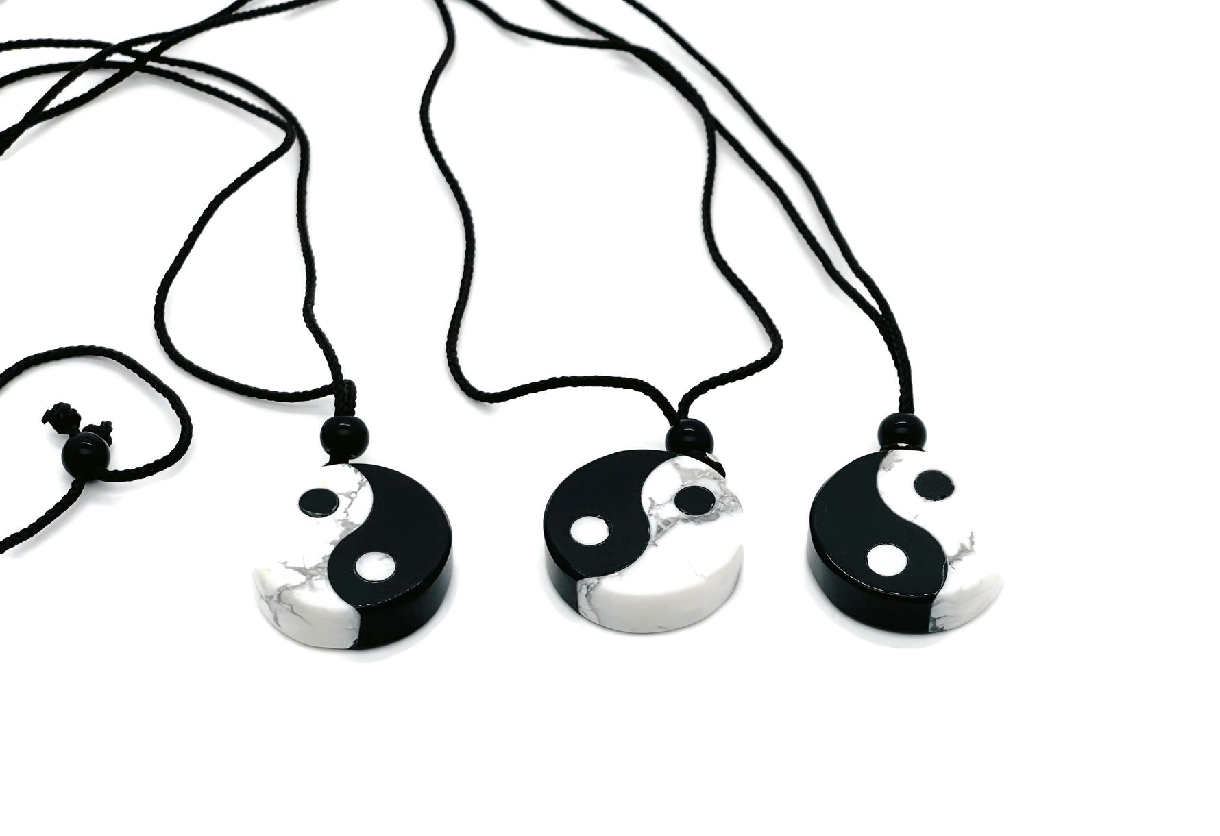 Handmade Yin Yang gemstone necklace featuring Howlite and Obsidian beads, with a yin yang pendant, by GemstoneGO.