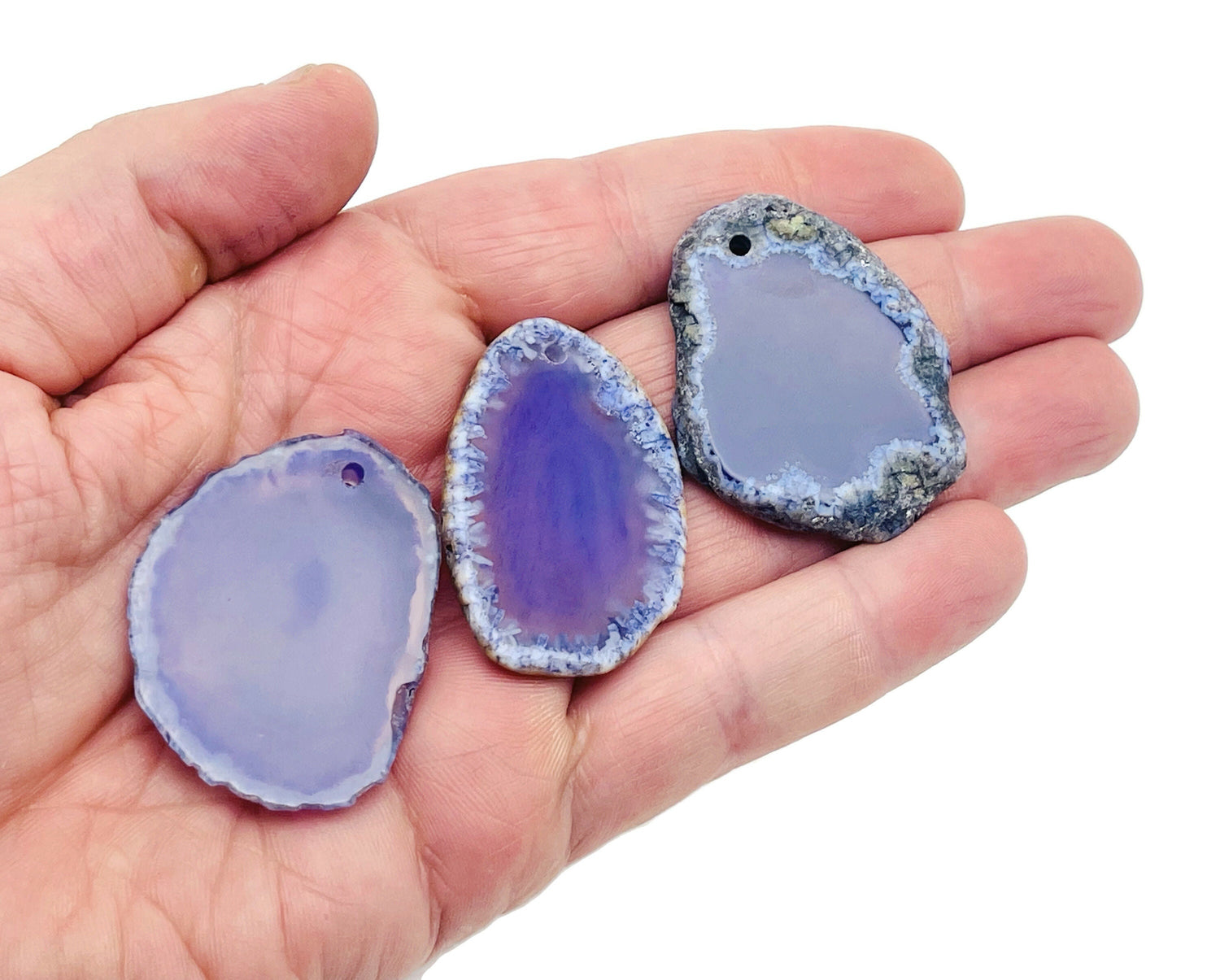 Purple agate slice drilled pendant featuring a natural geode with purple hues, handcrafted gemstone jewelry by GemstoneGO.