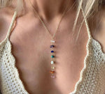 Seven Chakra crystal necklace with silver and gold accents, featuring colorful gemstone beads for spiritual balance and style.