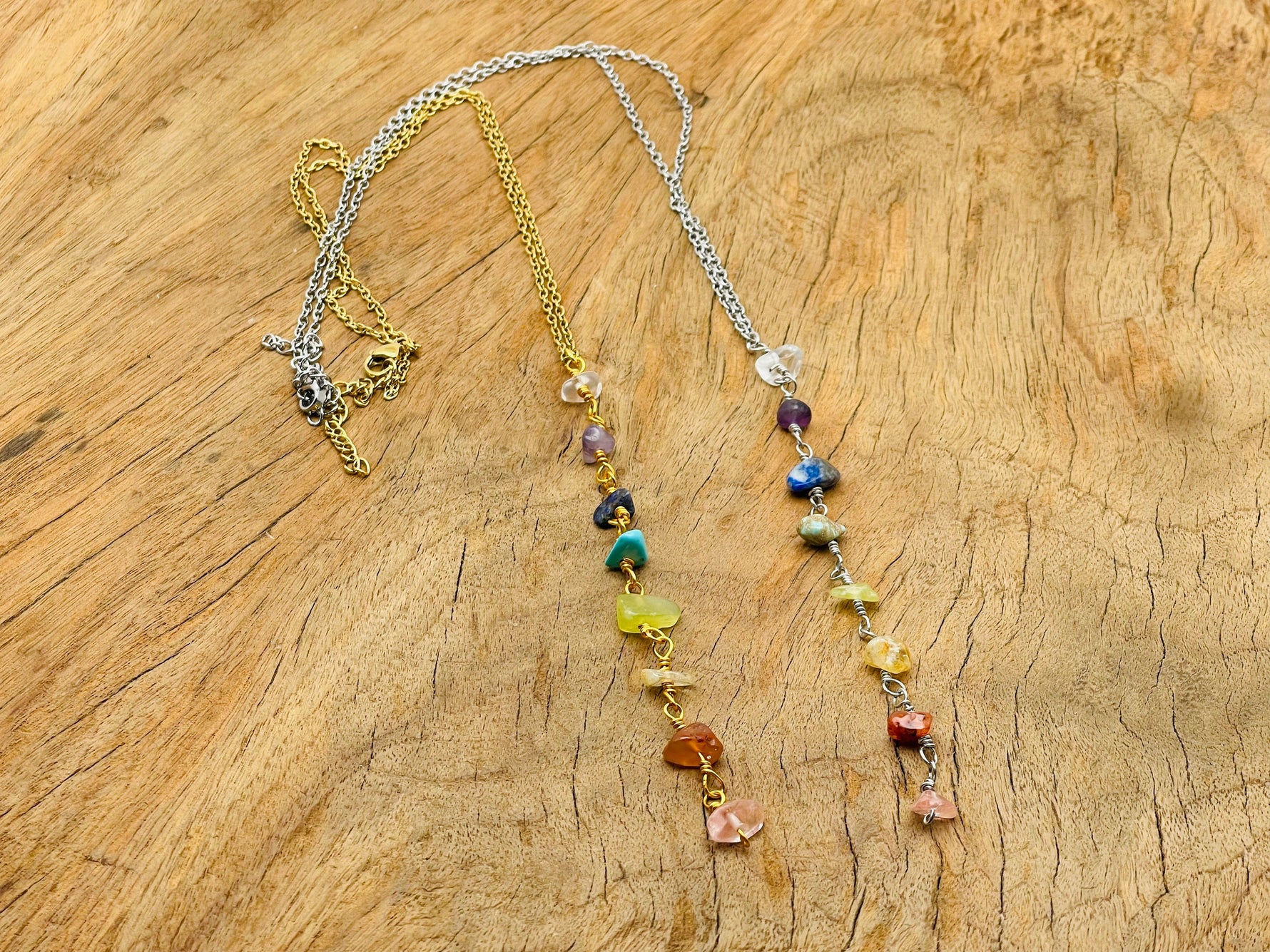 Silver and gold 7 chakra crystal necklace with colorful gemstone beads, designed by GemstoneGO for balanced energy.