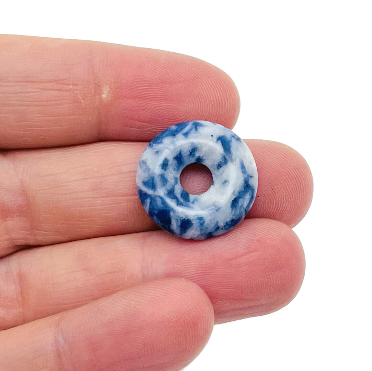 Blue Spot Jasper crystal donut from GemstoneGO, 20mm Pi Stone featuring vibrant blue spots and polished gemstone finish.