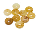 Yellow jade crystal donut pendant from GemstoneGO, 20mm Pi stone with polished, smooth surface and vibrant yellow color.