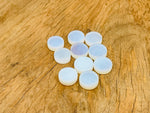 Round Opalite flat gemstone slab from GemstoneGO, showcasing a smooth, polished translucent crystal with a soft glow.