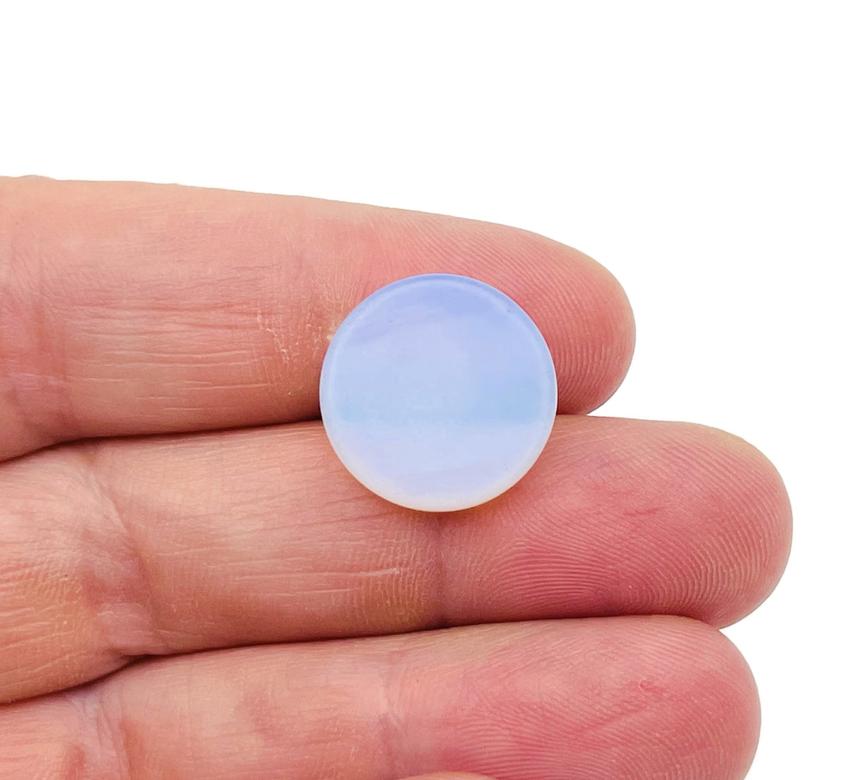 Round Opalite flat gemstone slab from GemstoneGO, showcasing smooth, translucent crystal with iridescent glow.