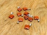 Red Jasper four-leaf clover crystal pendant from GemstoneGO, featuring a vibrant red jasper stone shaped like a four-leaf clover for jewelry making.