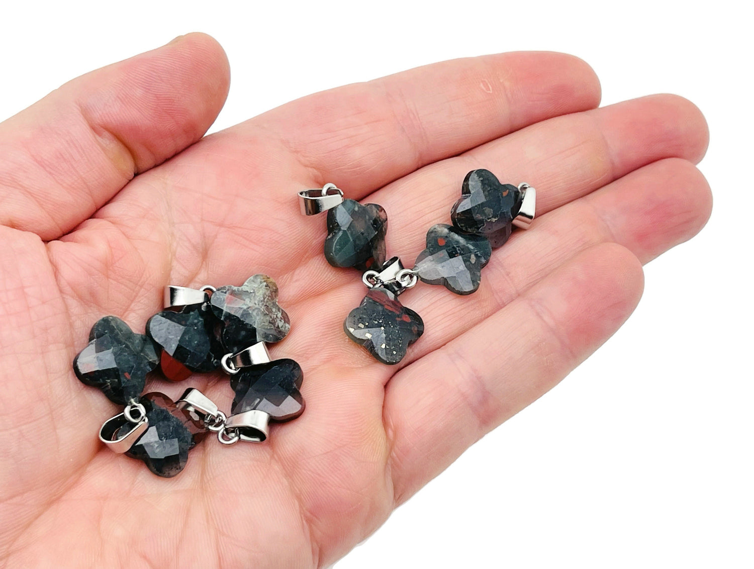 African Bloodstone four-leaf clover crystal pendant by GemstoneGO, showing a detailed green bloodstone pendant with four-leaf clover shape.