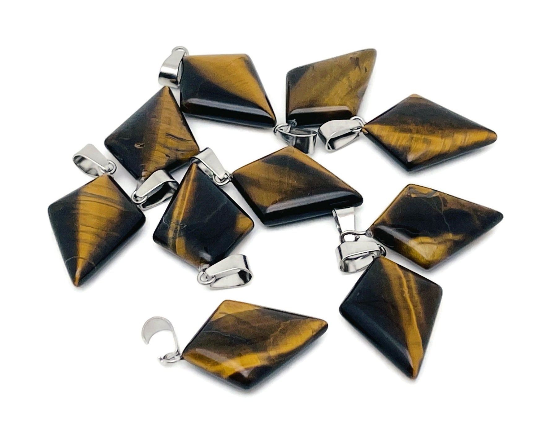 Tiger Eye triangle gemstone pendant from GemstoneGO, featuring a geometric design and polished finish for jewelry or accessories.
