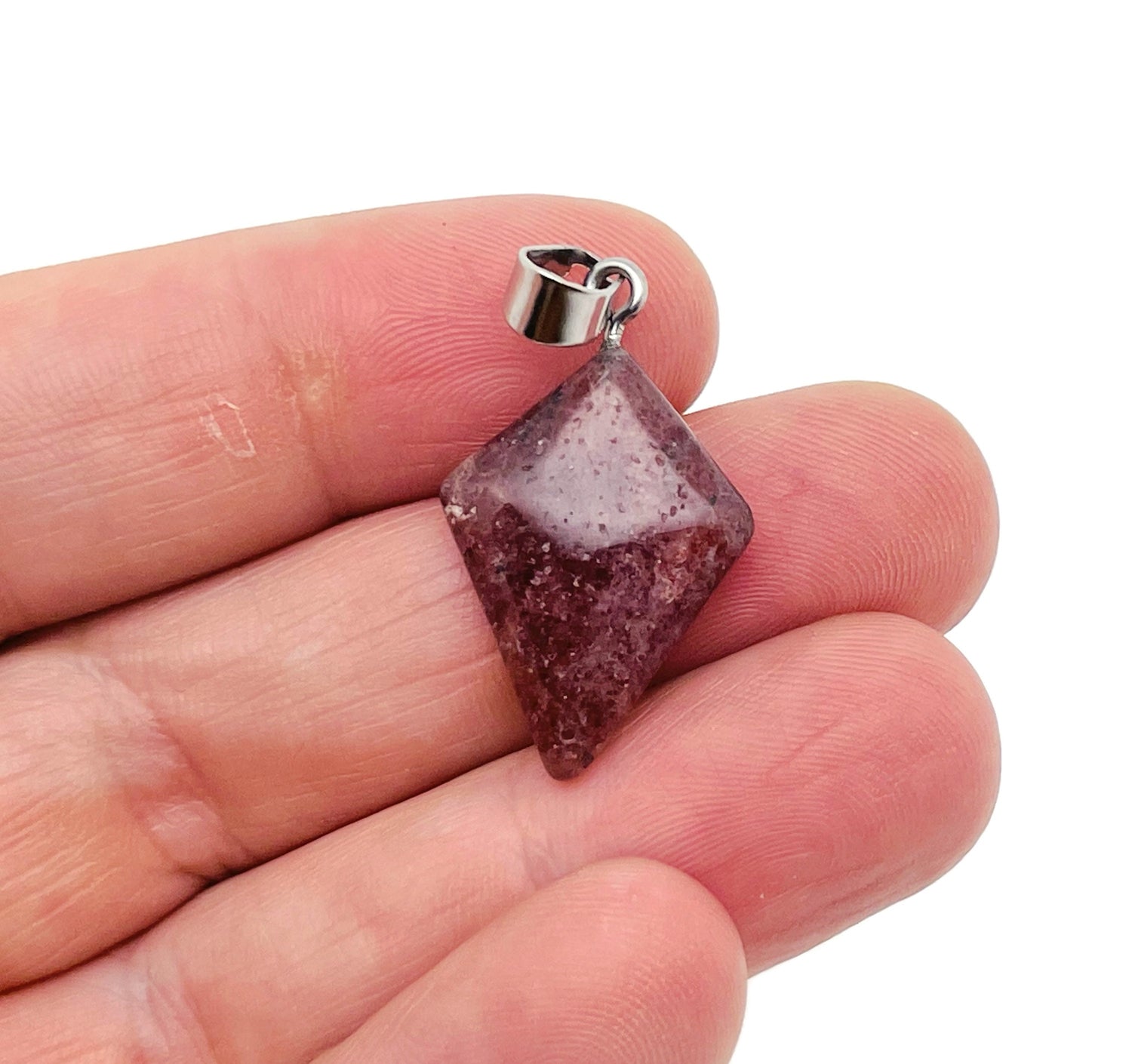 Strawberry Quartz triangle gemstone pendant from GemstoneGO, featuring a geometric design and natural pink-red color.