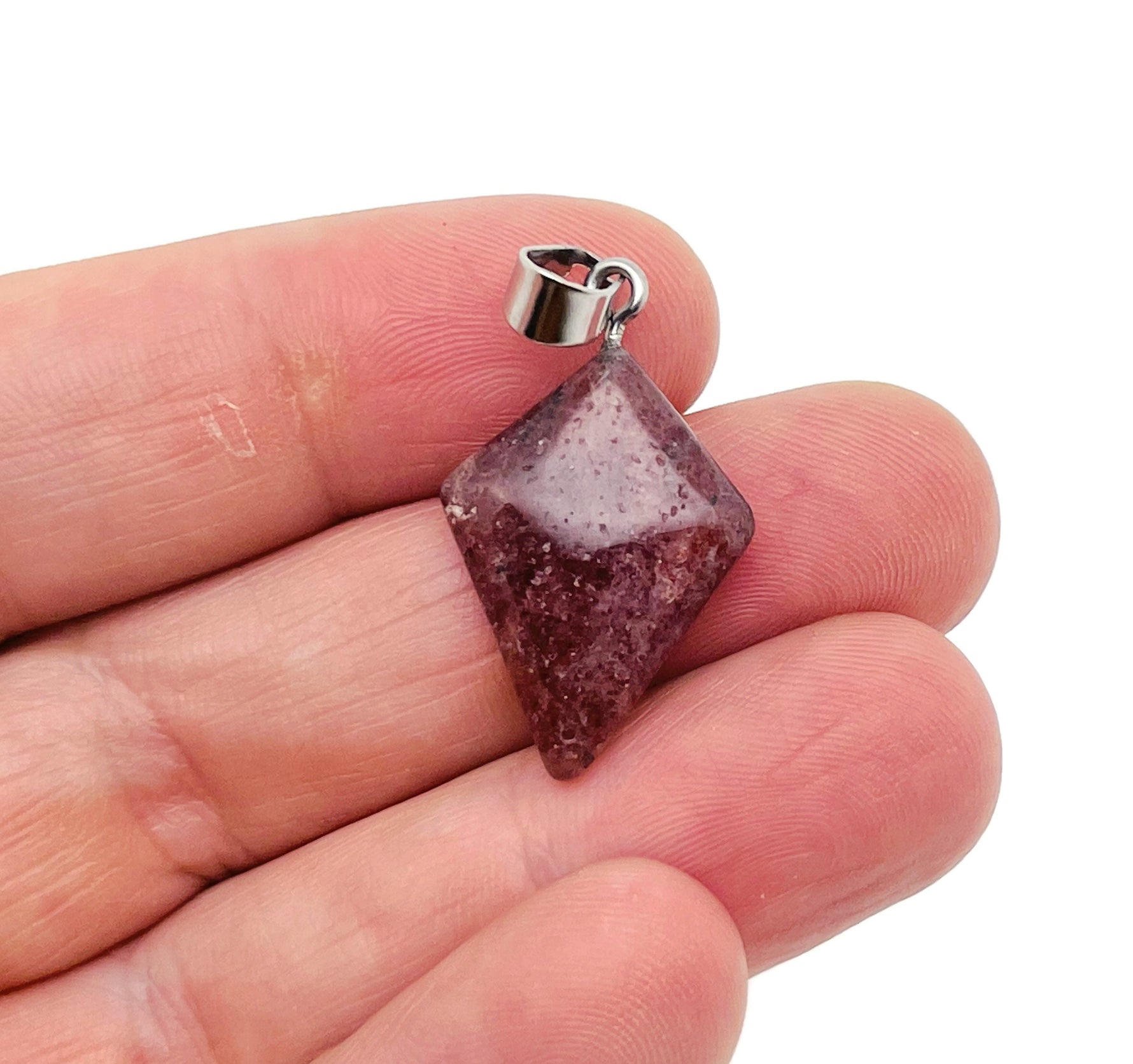 Strawberry Quartz triangle gemstone pendant from GemstoneGO, featuring a geometric design and natural pink-red color.