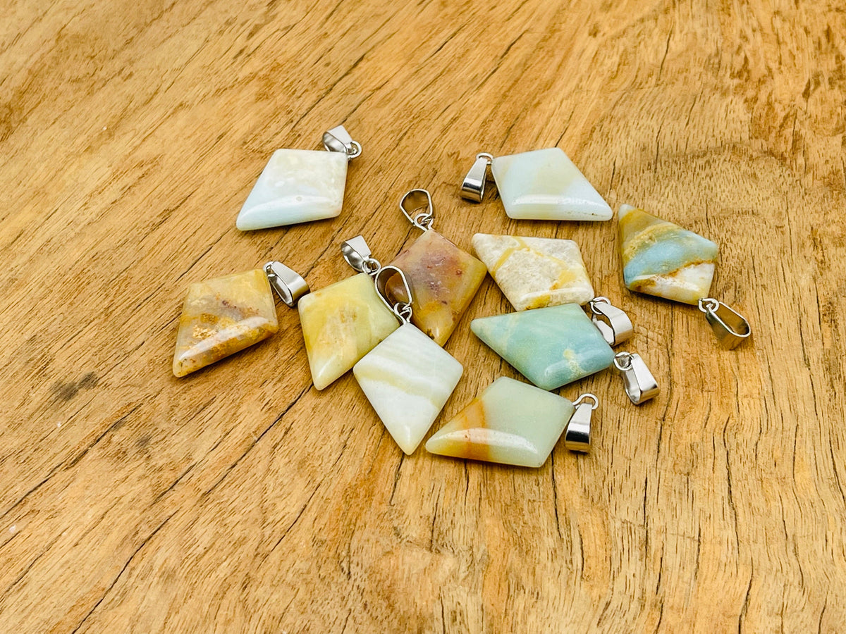 Amazonite triangle gemstone pendant from GemstoneGO, featuring a geometric design with a polished blue-green mineral surface.