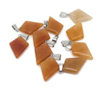 Orange aventurine triangle gemstone pendant with geometric design, showcasing vibrant orange color and polished finish.