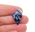 Sodalite triangle gemstone pendant with geometric design by GemstoneGO, showcasing deep blue and white mineral patterns.