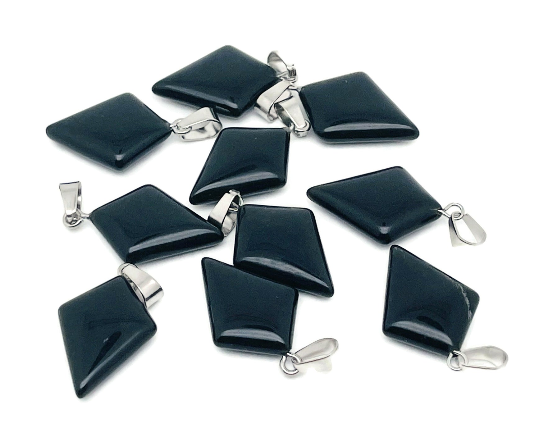 Obsidian triangle gemstone pendant with geometric design, featuring a smooth black gemstone on a silver chain.