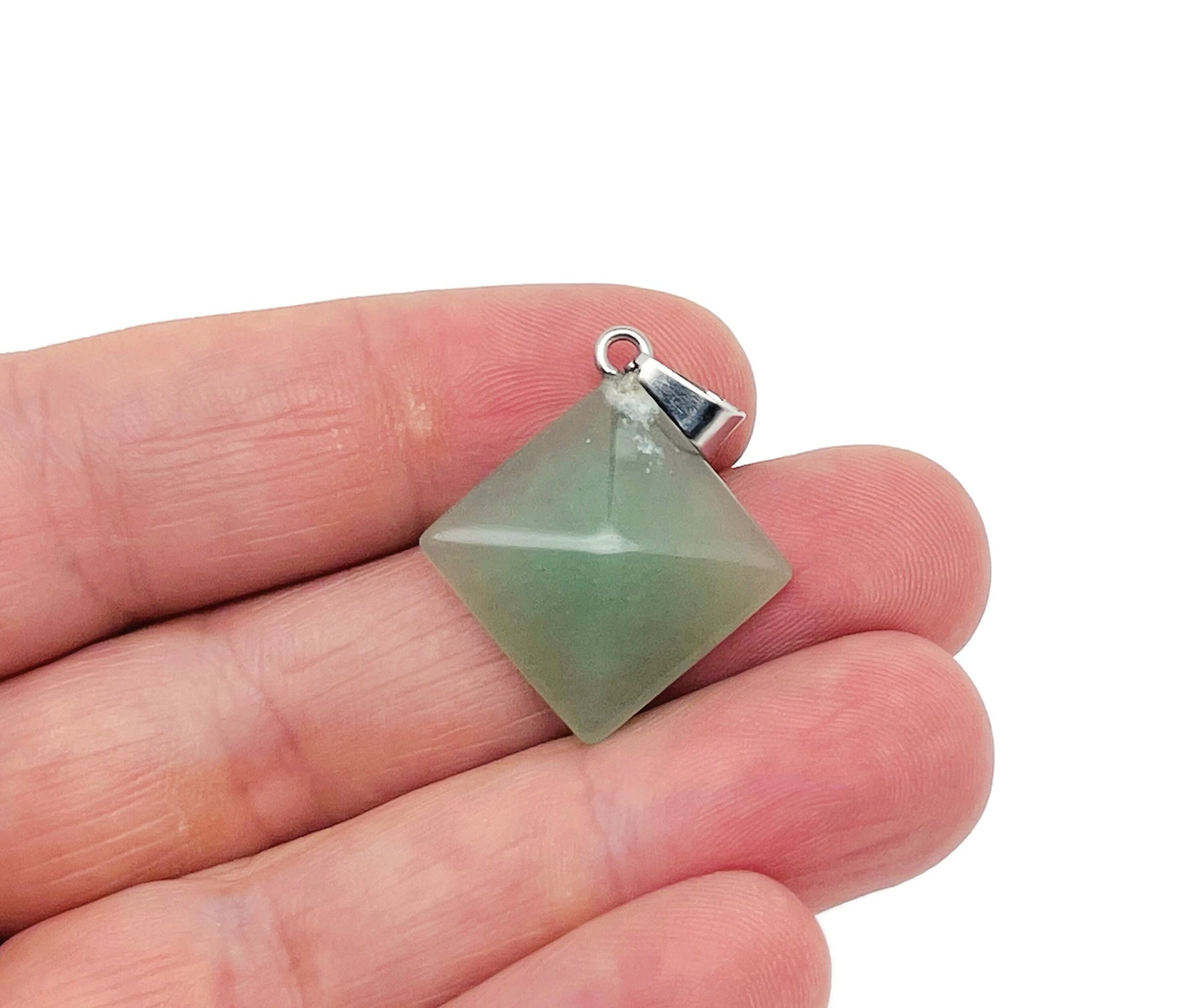A natural aventurine pyramid gemstone pendant with earthy green hues, showcasing a smooth, polished pyramid shape in jewelry style.