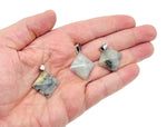 Labradorite pyramid gemstone pendant from GemstoneGO, showcasing a natural iridescent gemstone with a pointed pyramid shape.