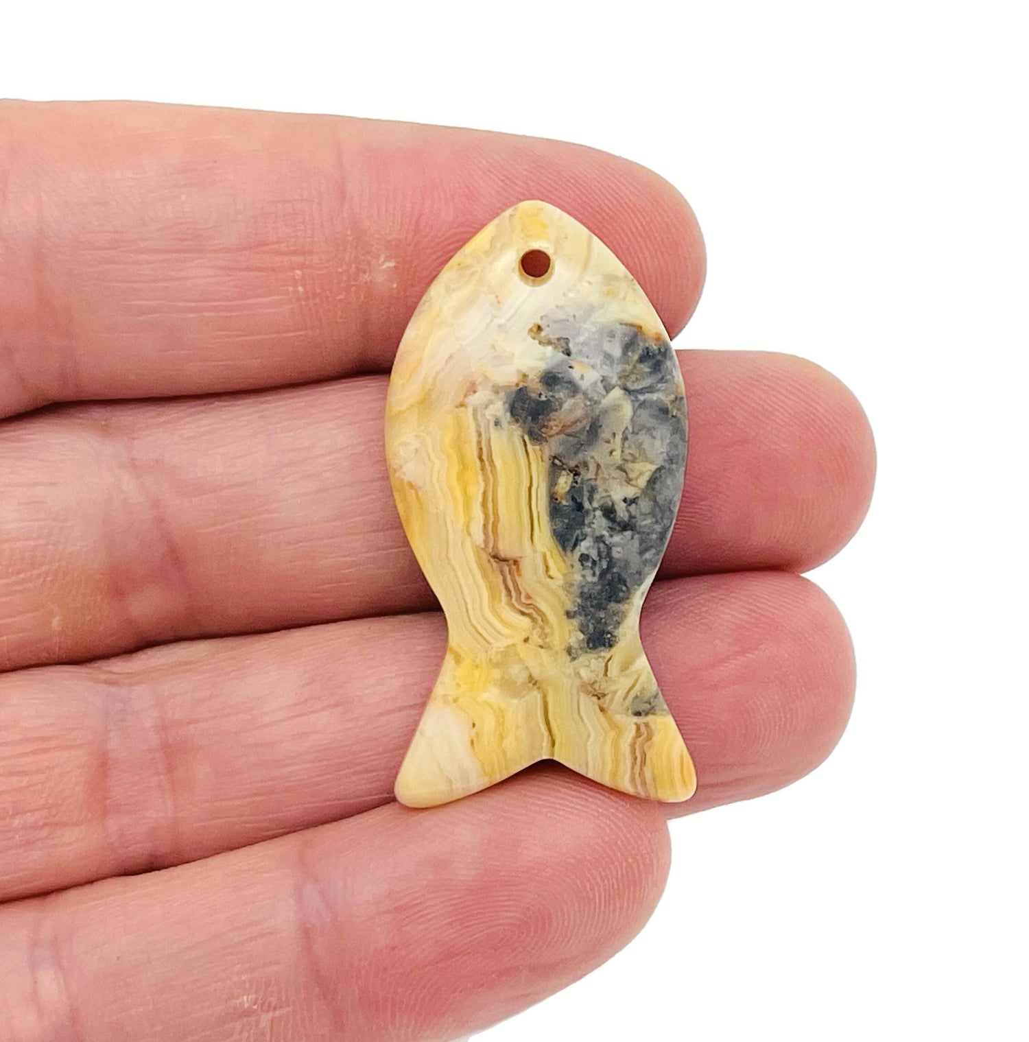 Crazy Lace Agate fish-shaped gemstone pendant with Pisces zodiac hole crystal, crafted by GemstoneGO.
