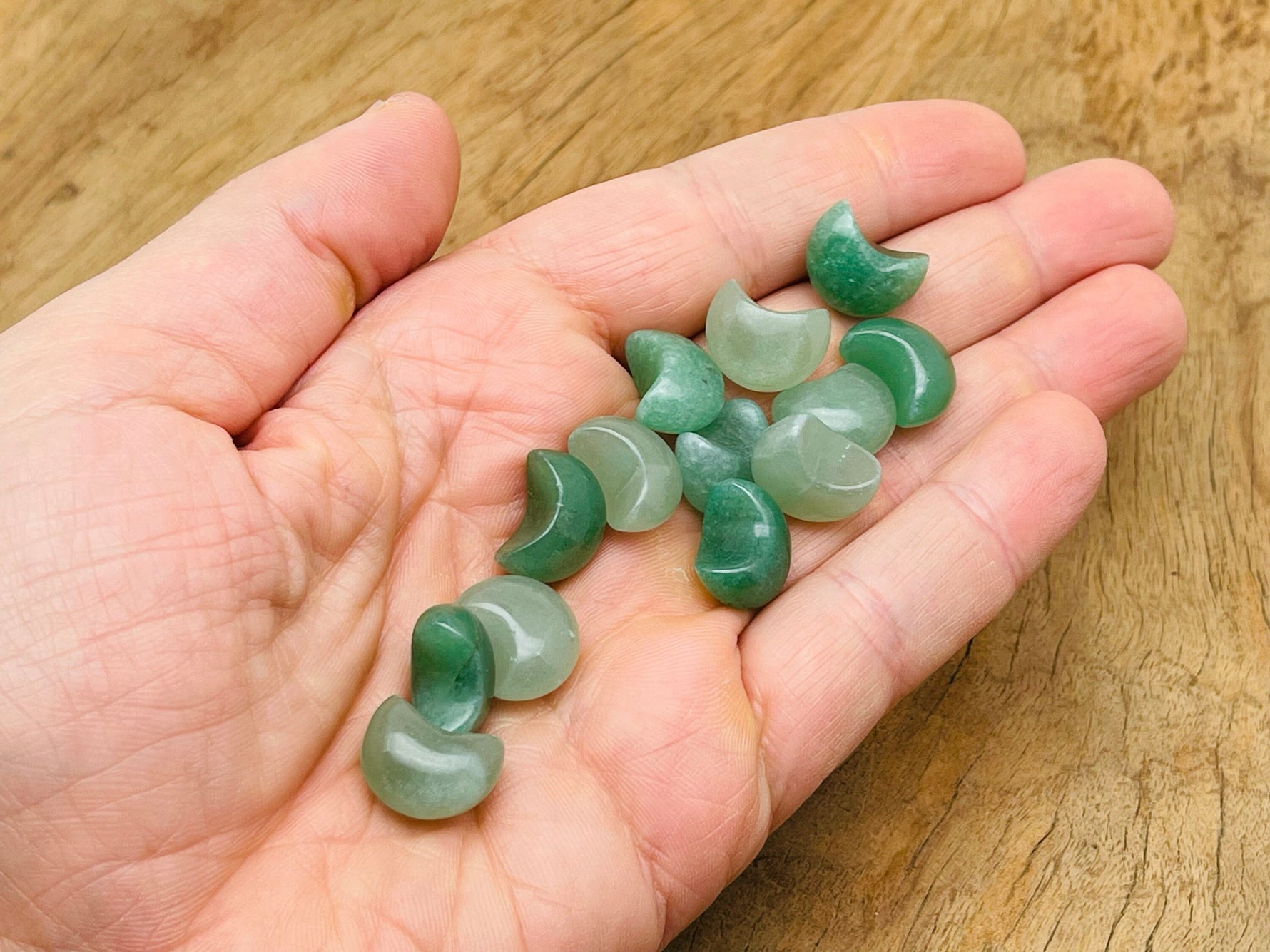 Aventurine gemstone moon puffy bead, 15x9mm, from GemstoneGO, showing a smooth, polished green stone with a moon shape.