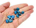 Blue Apatite heart-shaped pendant from GemstoneGO, featuring a mini crystal design, set against a neutral background.