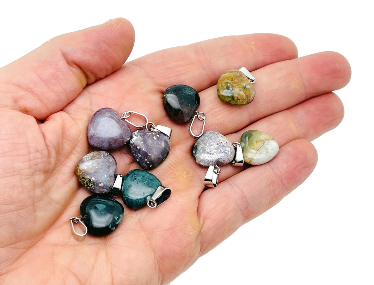 Moss Agate heart-shaped pendant from GemstoneGO, small crystal pendant with natural green and brown mineral patterns.