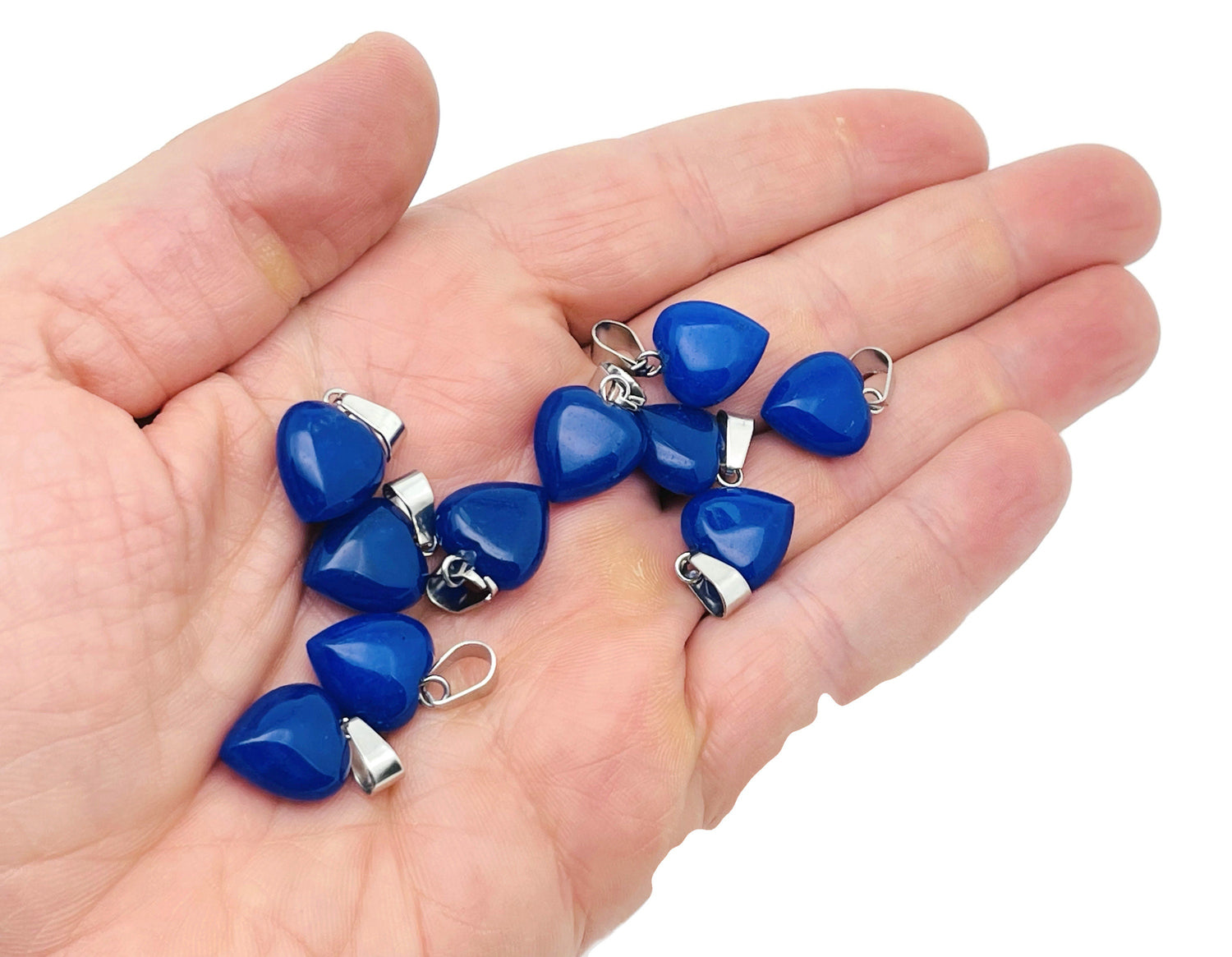 Blue jade heart pendant with mini crystal accent from GemstoneGO, showcasing a polished gemstone with a delicate chain.