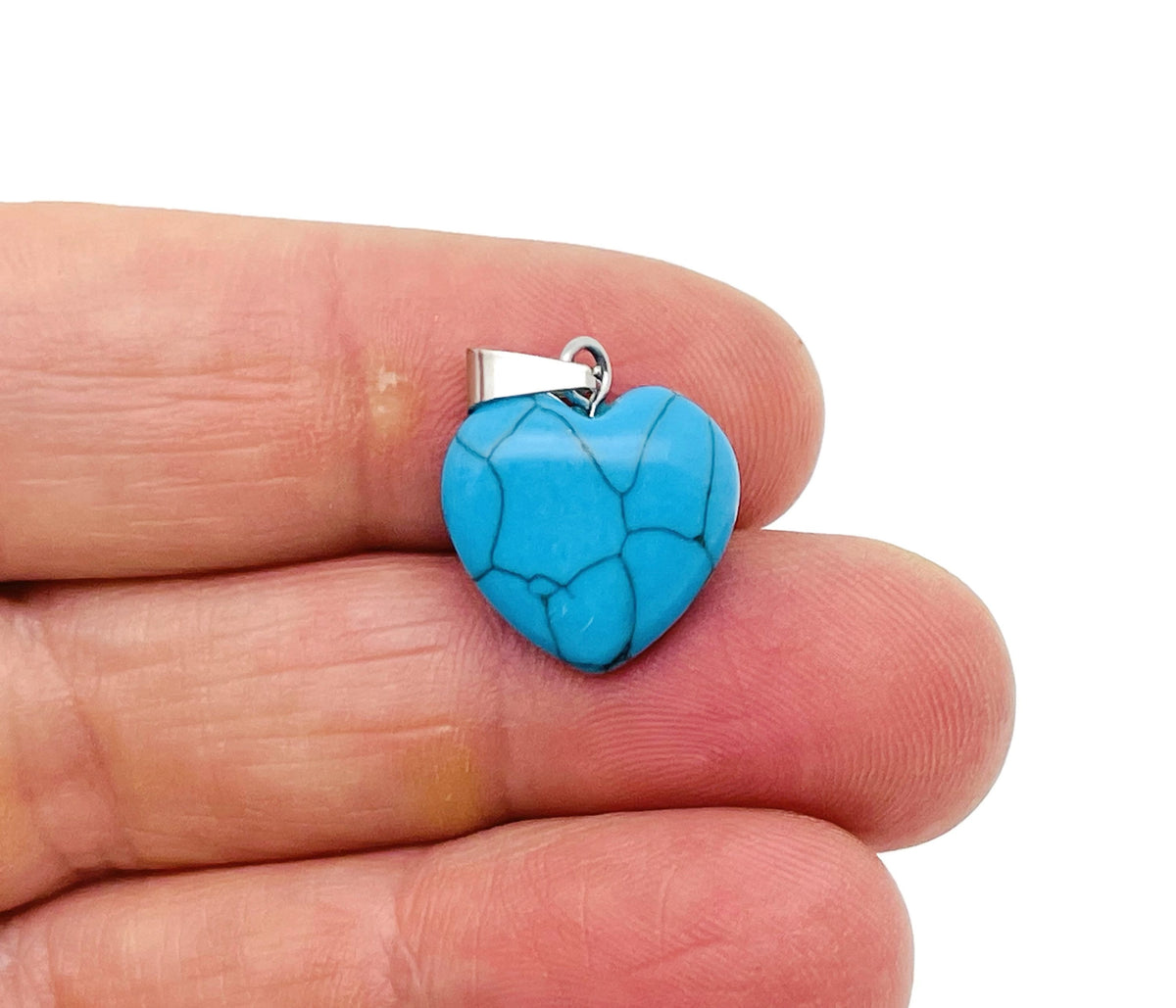 Mini turquoise heart pendant with crystal accents from GemstoneGO, showcasing a delicate jewelry piece with vibrant color and intricate details.