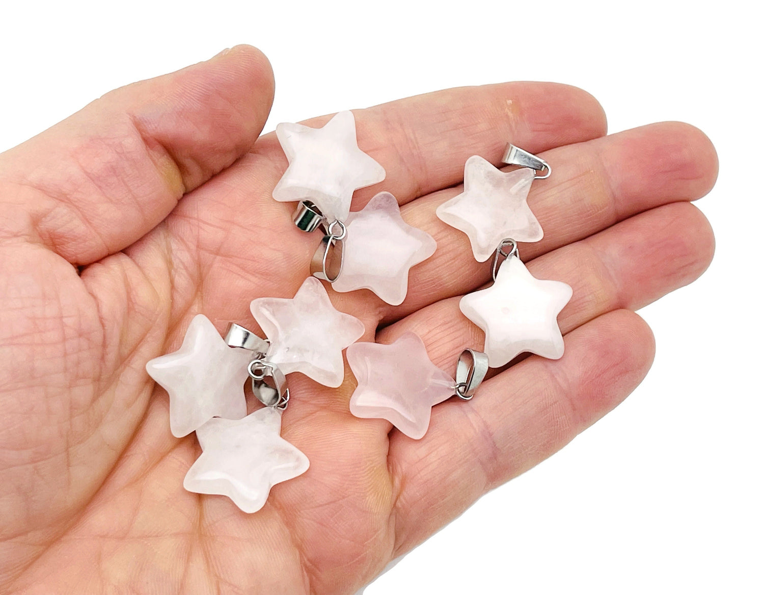Rose quartz star pendant from GemstoneGO featuring a polished crystal gemstone for jewelry making and accessories.