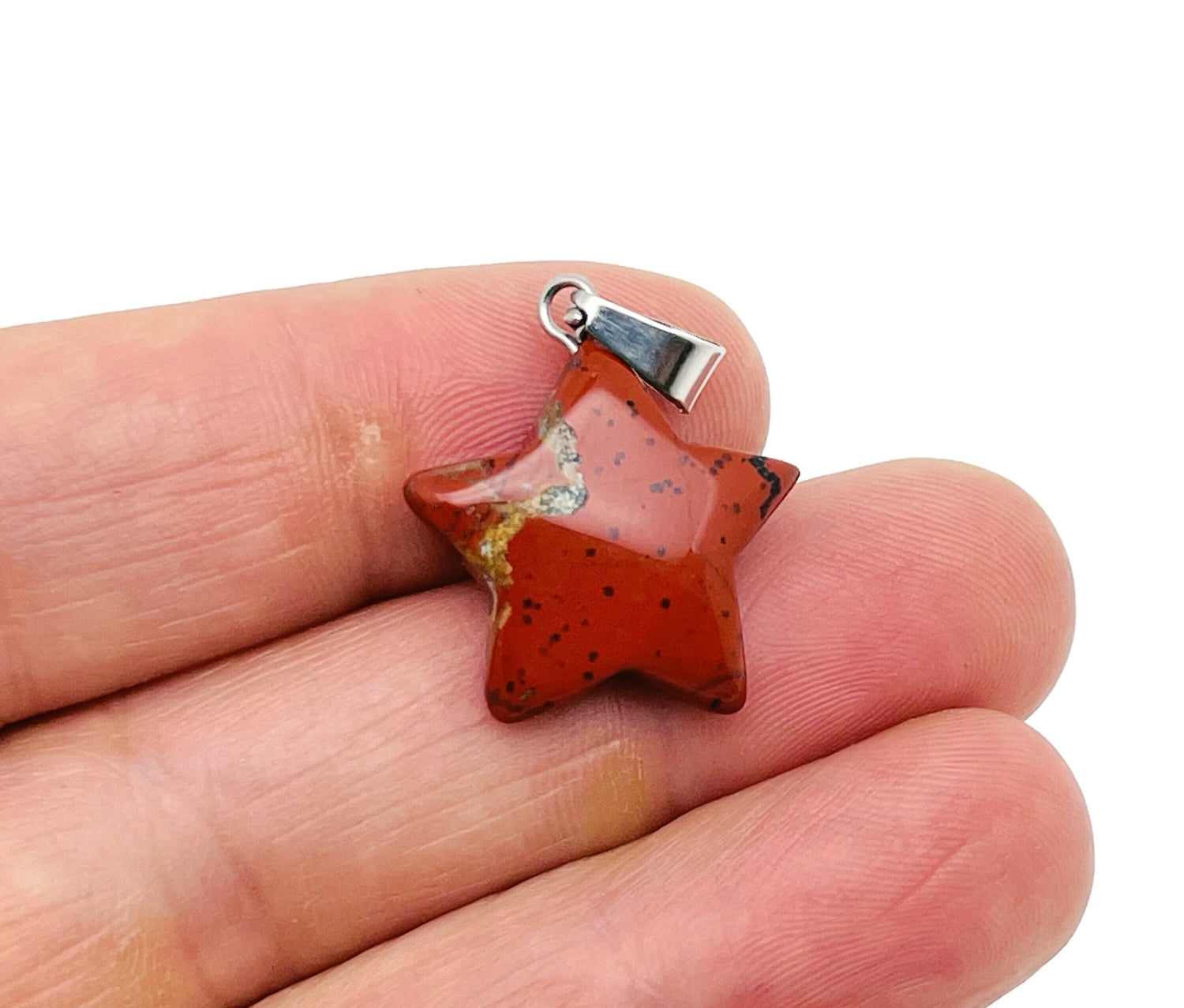 Red Jasper star pendant from GemstoneGO, a crystal jewelry-making supply featuring a polished red jasper star-shaped pendant.