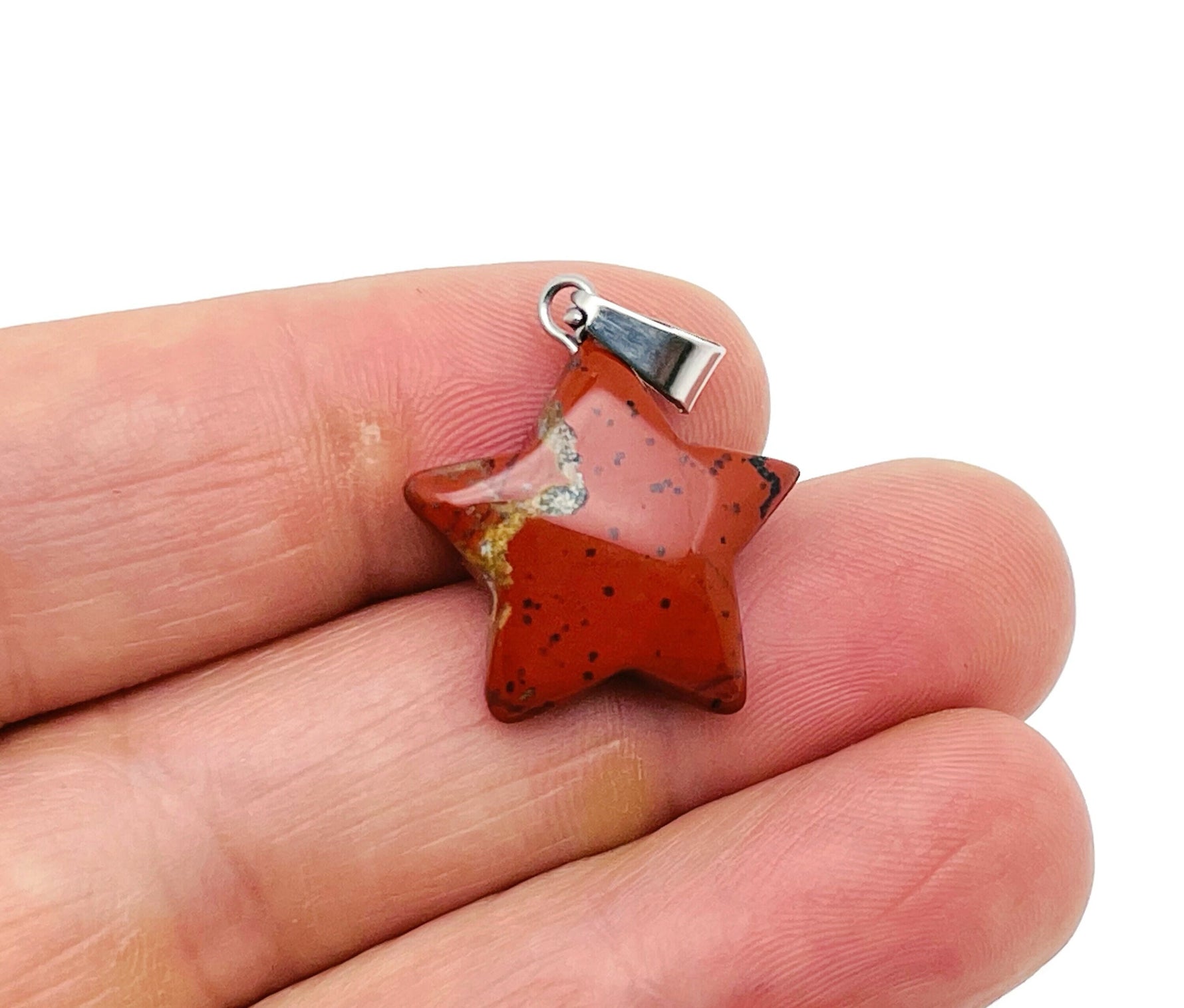 Red Jasper star pendant from GemstoneGO, a crystal jewelry-making supply featuring a polished red jasper star-shaped pendant.