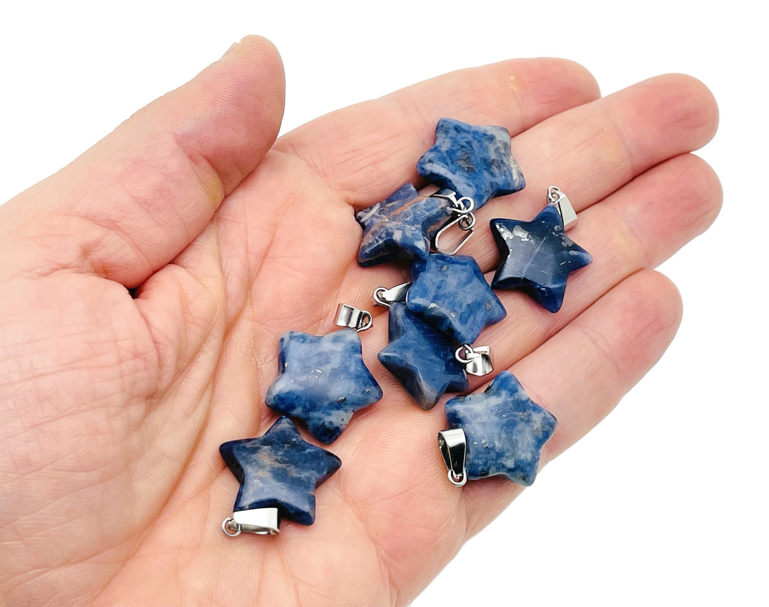 Sodalite star-shaped crystal pendant from GemstoneGO, ideal for jewelry making, featuring deep blue and white stone details.