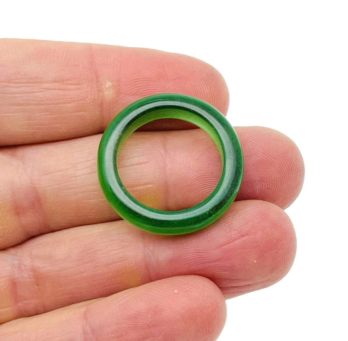 Green Cats Eye Crystal ring featuring a vibrant green gemstone set in a silver band, showcasing elegant gemstone jewelry.