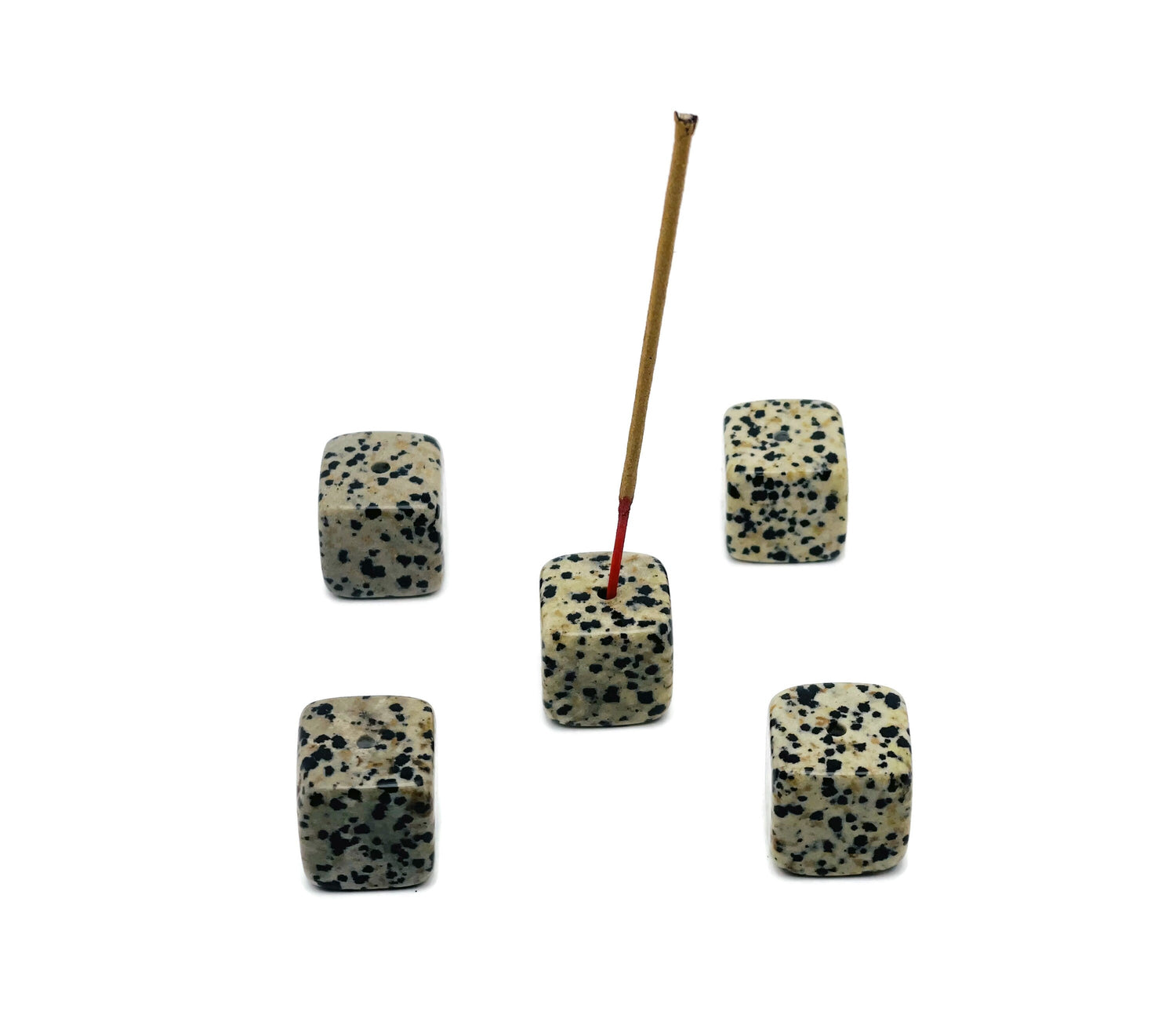 Dalmatian Jasper crystal incense holder with carved design, showcasing a smooth, polished stone for burning incense sticks.