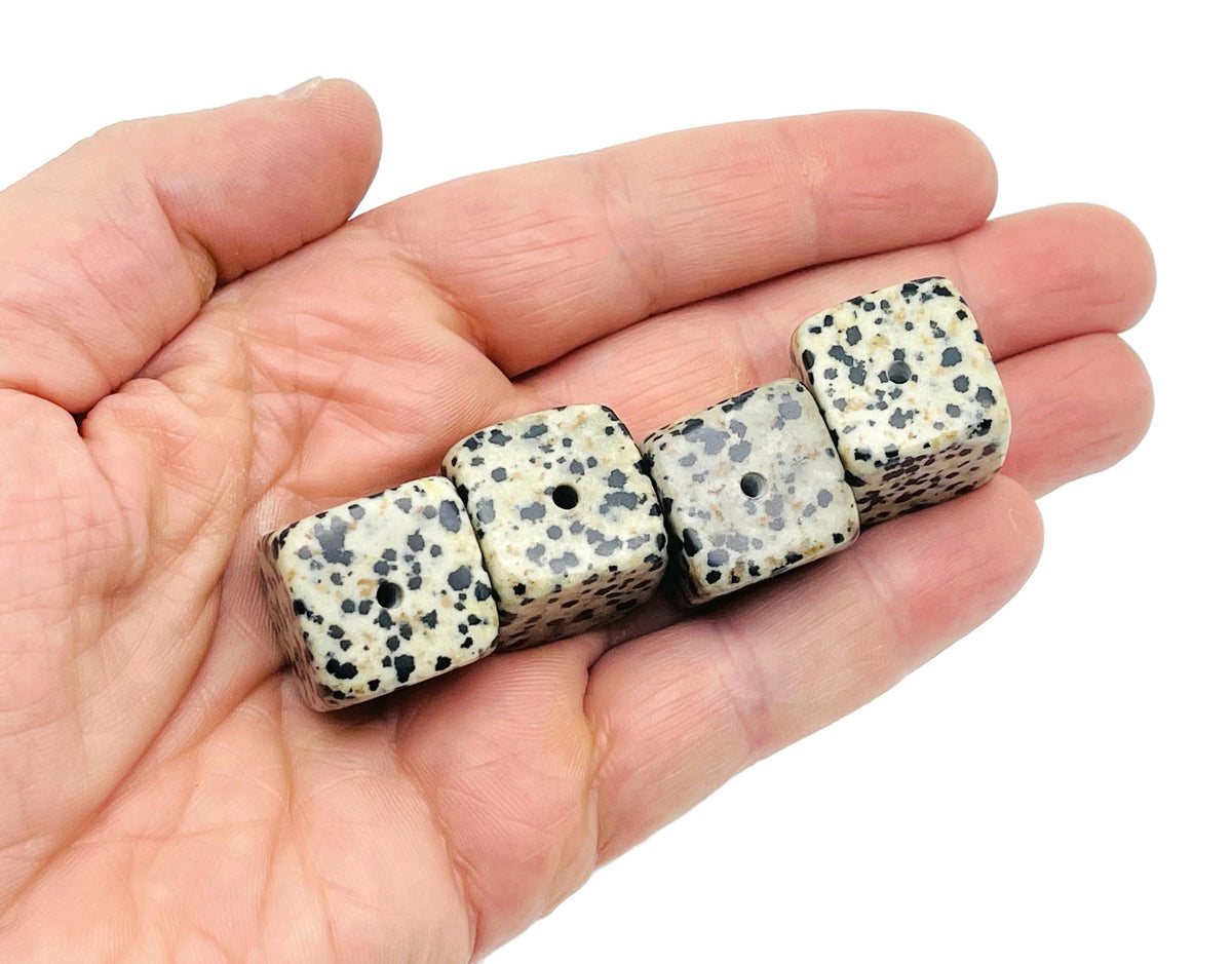 Handcrafted Dalmatian Jasper crystal incense holder with carved design, ideal for holding incense sticks.
