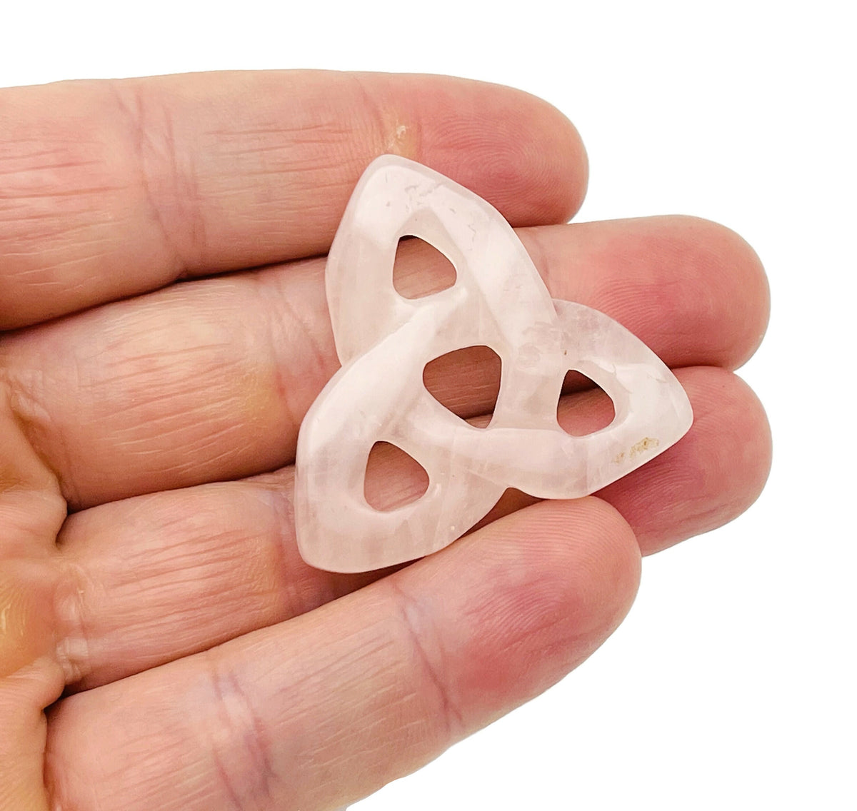 Rose Quartz Celtic Knot carved gemstone Trinity Crystal by GemstoneGO, featuring intricate knot design on polished pink stone.