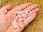 Rose Quartz gemstone moon puffy pendant, 15x9mm, featuring a soft pink hue and smooth, rounded shape from GemstoneGO.
