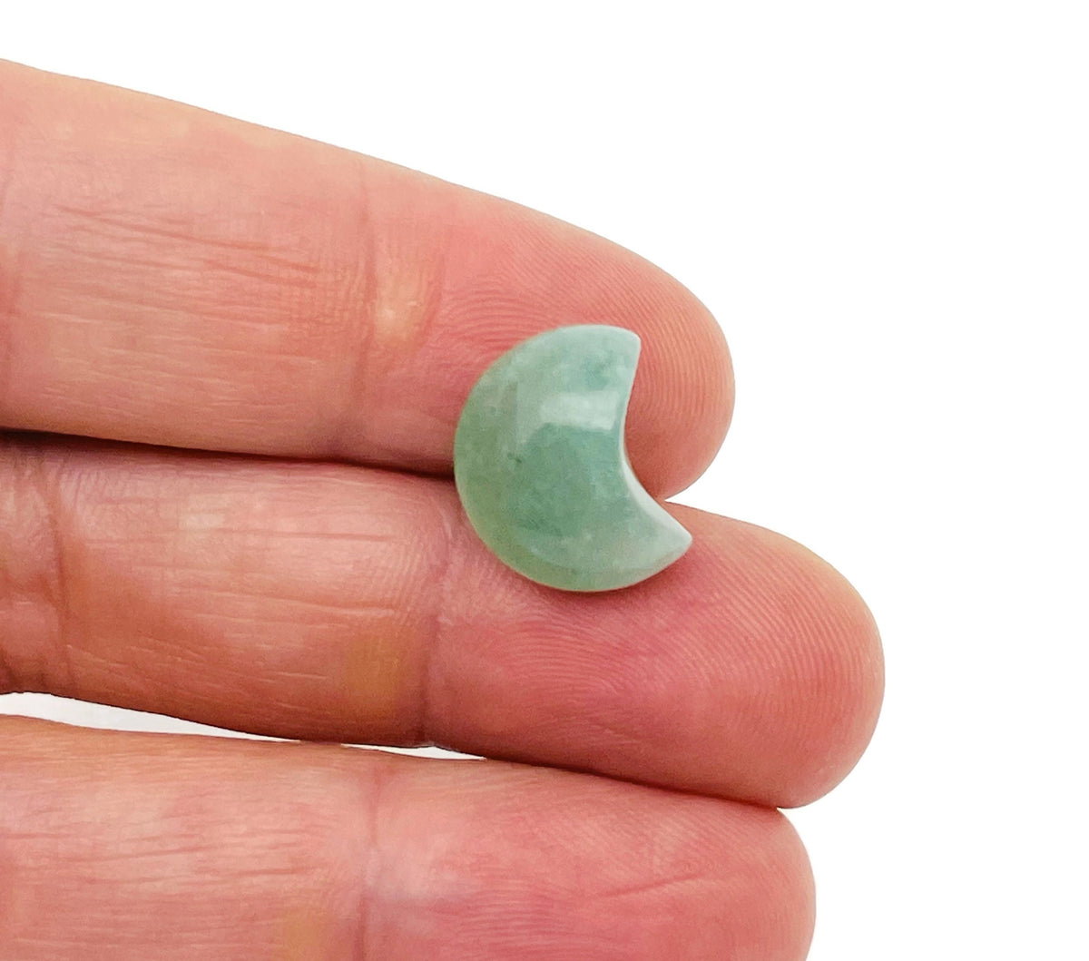 Aventurine gemstone moon-shaped puffy pendant, 15x9mm, from GemstoneGO, showing its smooth, green and shimmering surface.