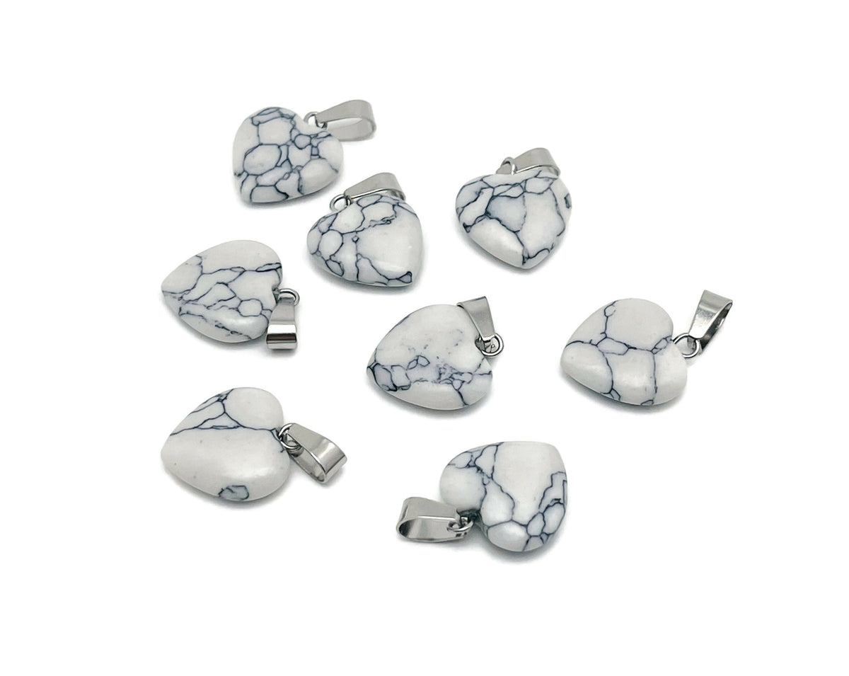 Mini Howlite heart pendant from GemstoneGO featuring a smooth, white gemstone heart crystal for jewelry or accessories.