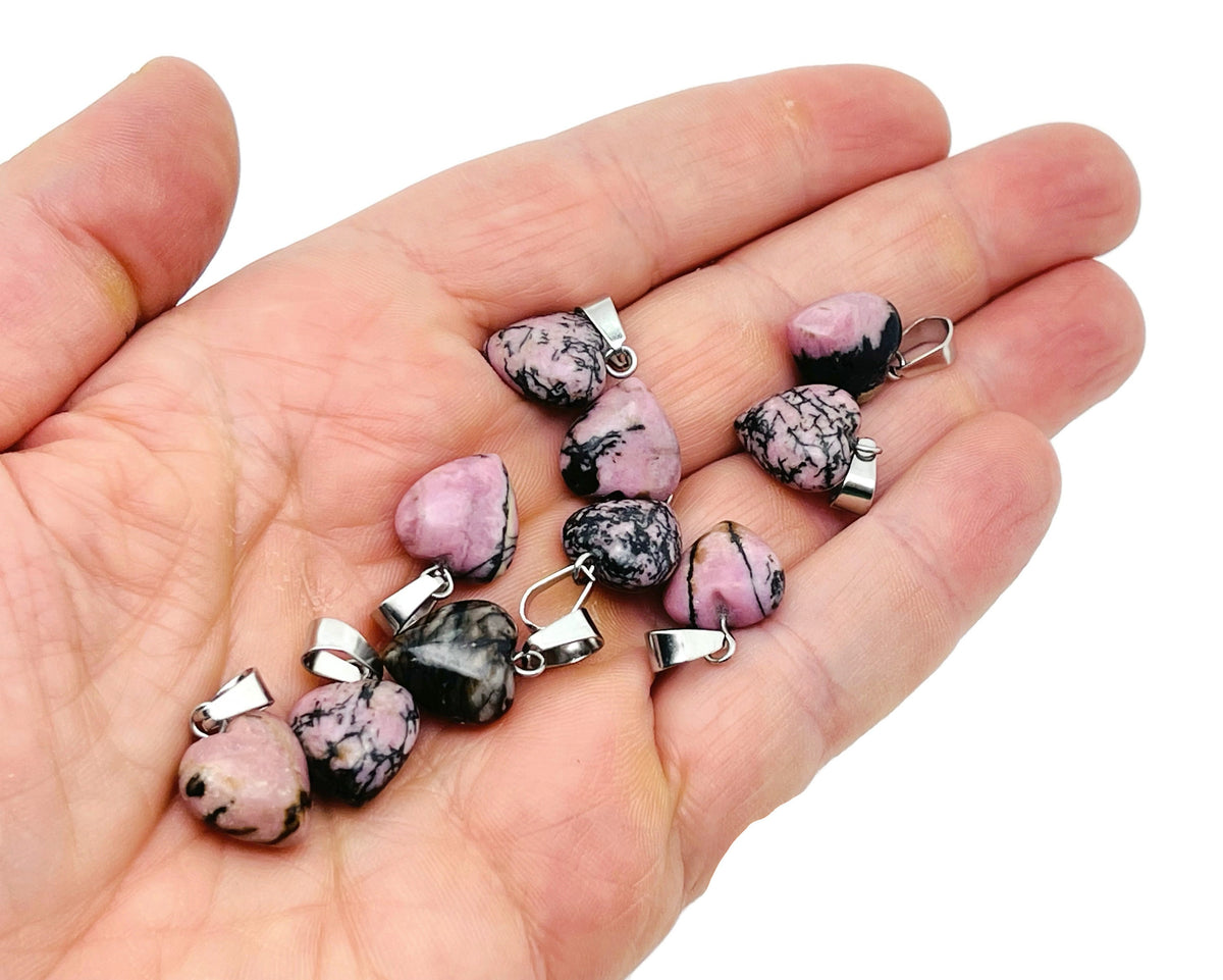 Rhodonite heart pendant by GemstoneGO featuring a mini crystal-shaped design on a silver chain.