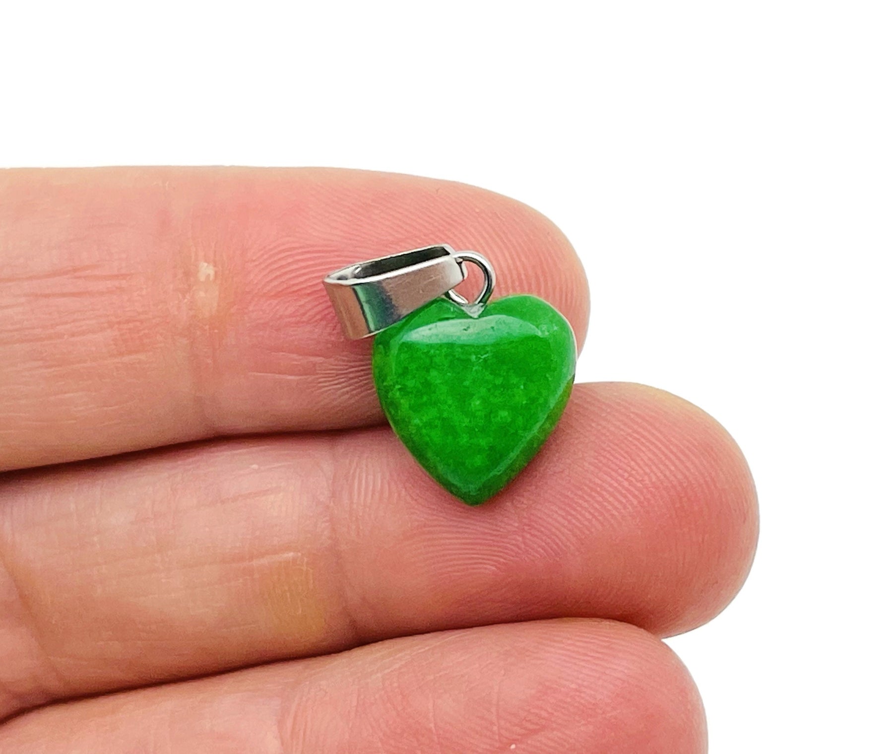 Green jade heart pendant with a mini crystal charm from GemstoneGO, showcasing a polished, vibrant gemstone jewelry piece.