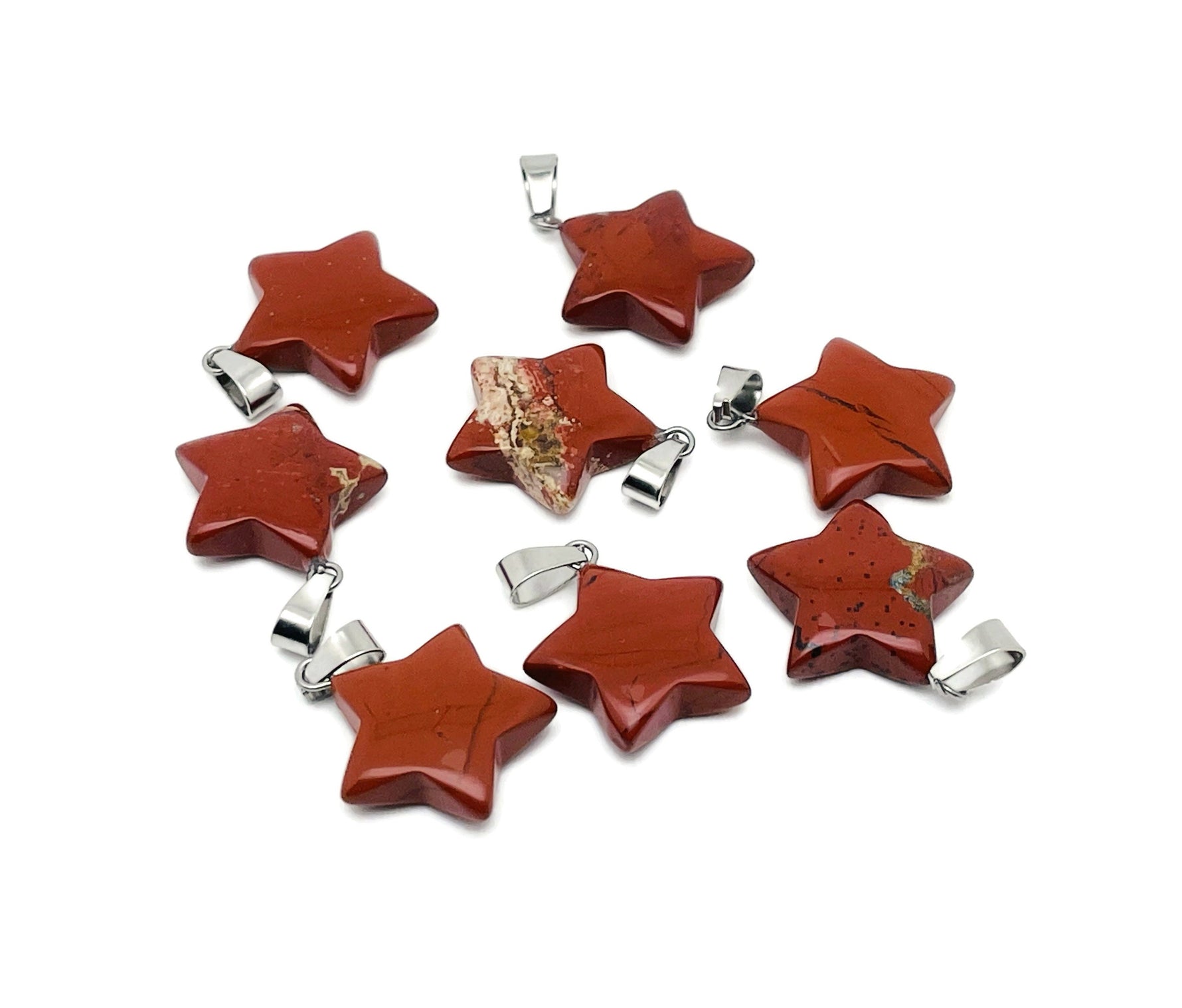 Red Jasper star pendant from GemstoneGO, crystal jewelry making supplies, showcasing a vibrant red gemstone in a star shape.
