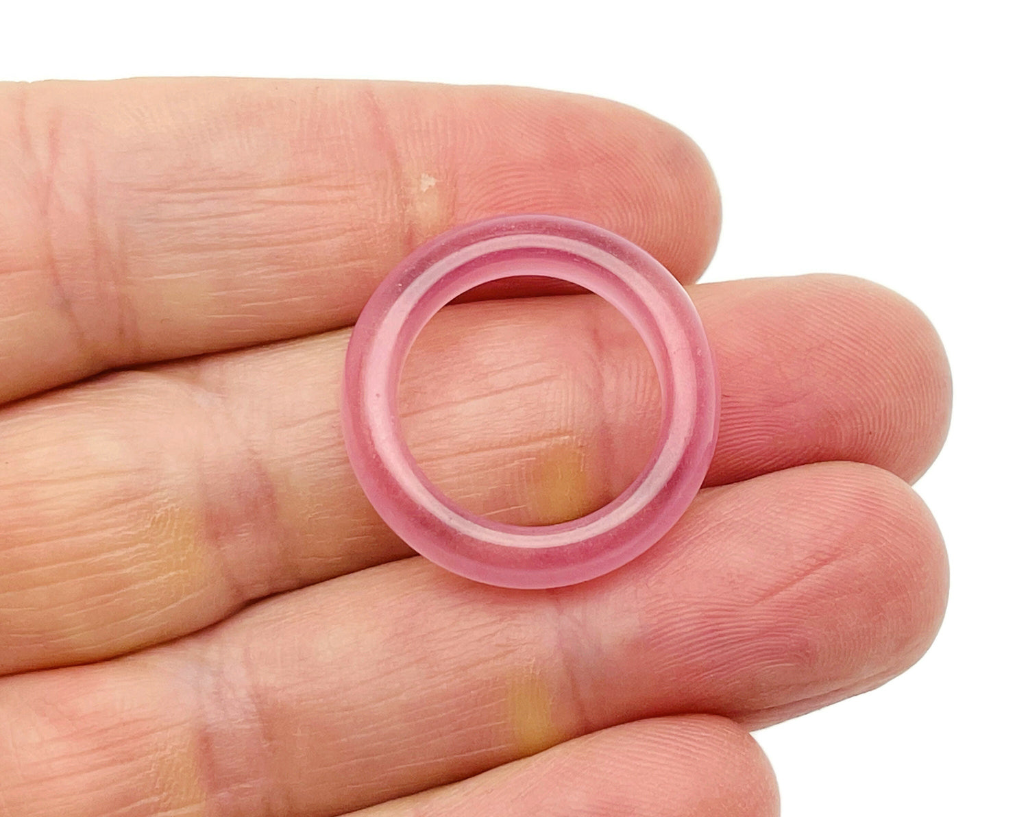 Pink Cats Eye Crystal Ring from GemstoneGO featuring a vibrant pink cat's eye gemstone set in a silver band.