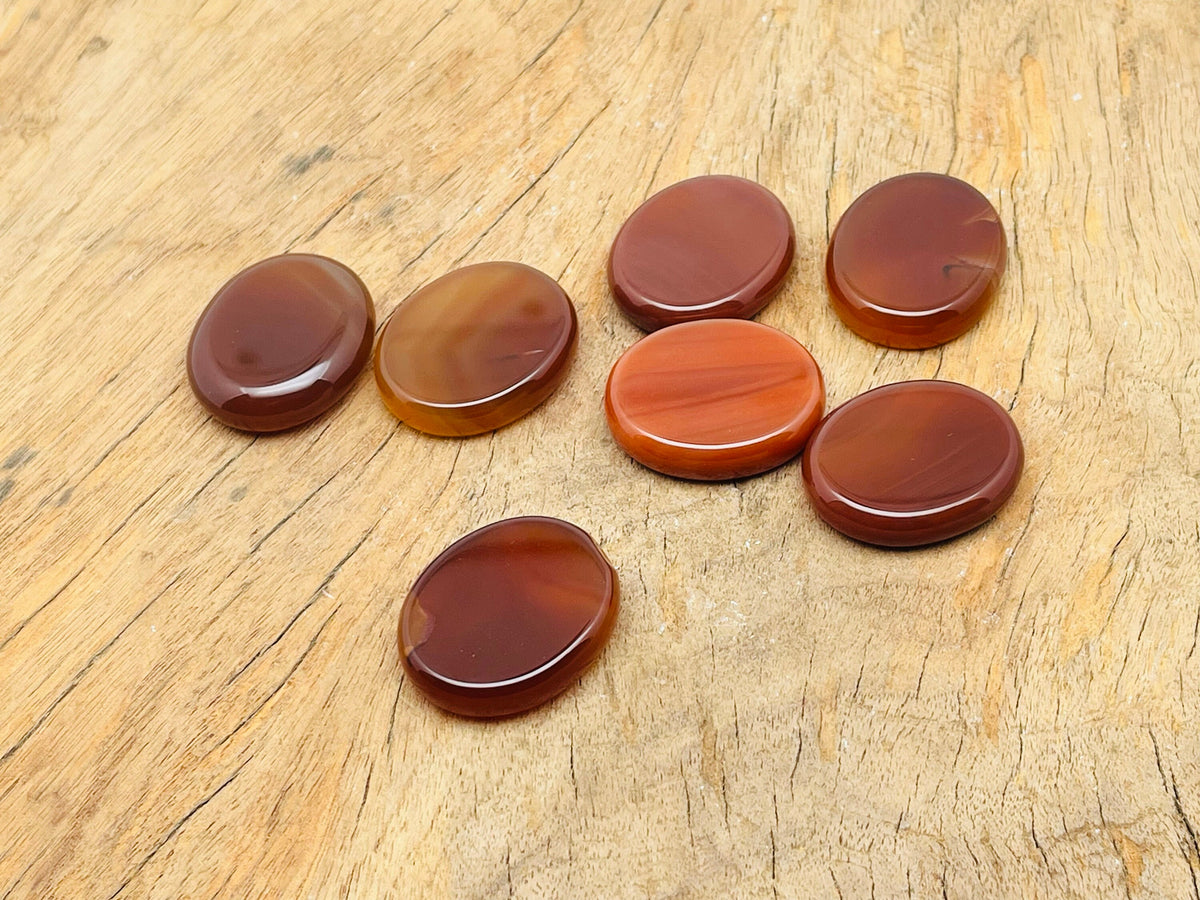 Carnelian flat gemstone slab from GemstoneGO, 30x25x7 cm, showcasing vibrant orange color and smooth polished surface.