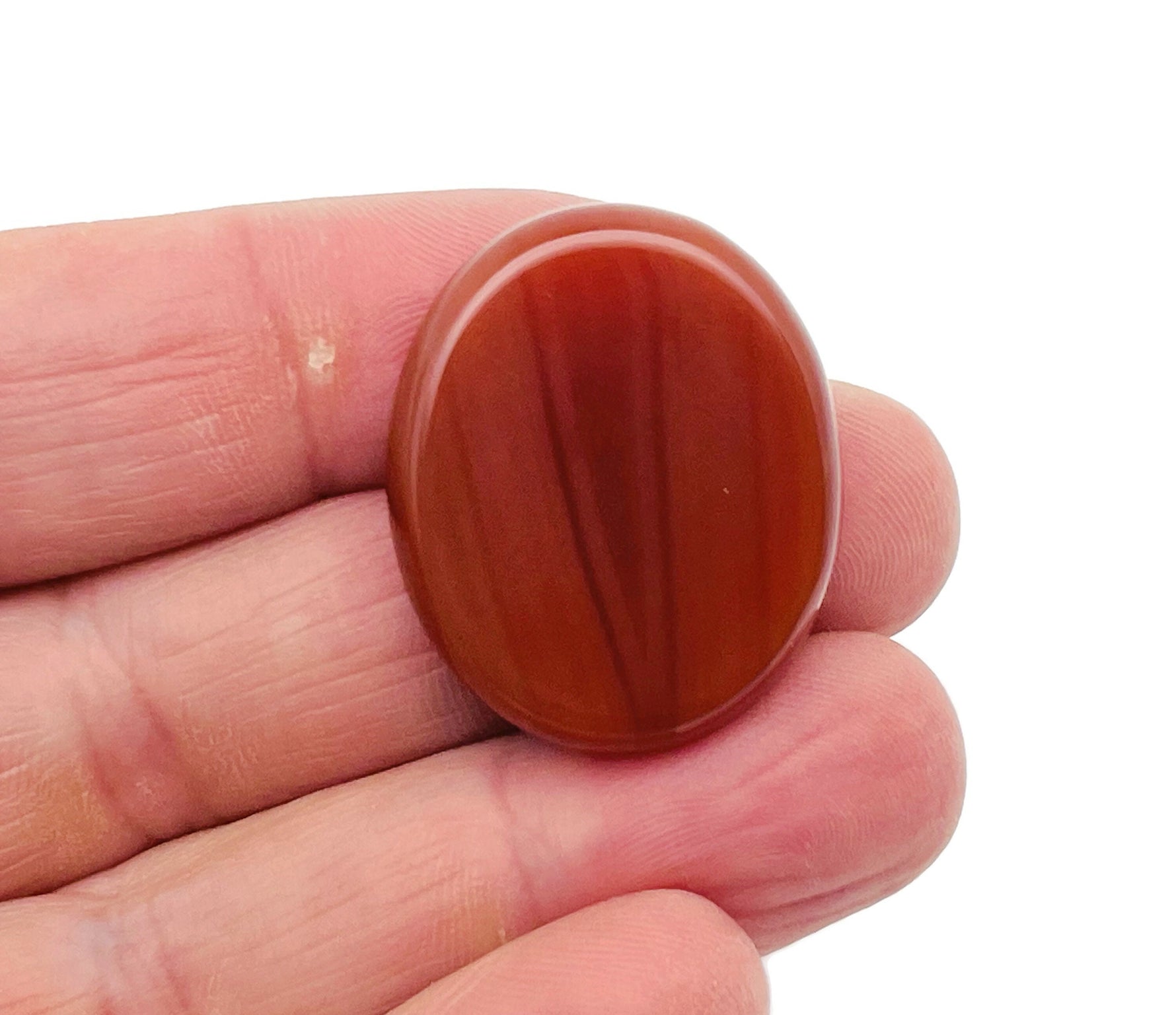 Carnelian flat gemstone slab from GemstoneGO, measuring 30x25x7mm, showcasing vibrant orange-red color and smooth polished surface.
